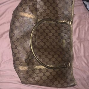 Authentic Gucci handbag handles and zipper intact